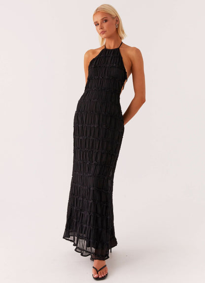 Black halter maxi dress with pleated texture and side cutouts