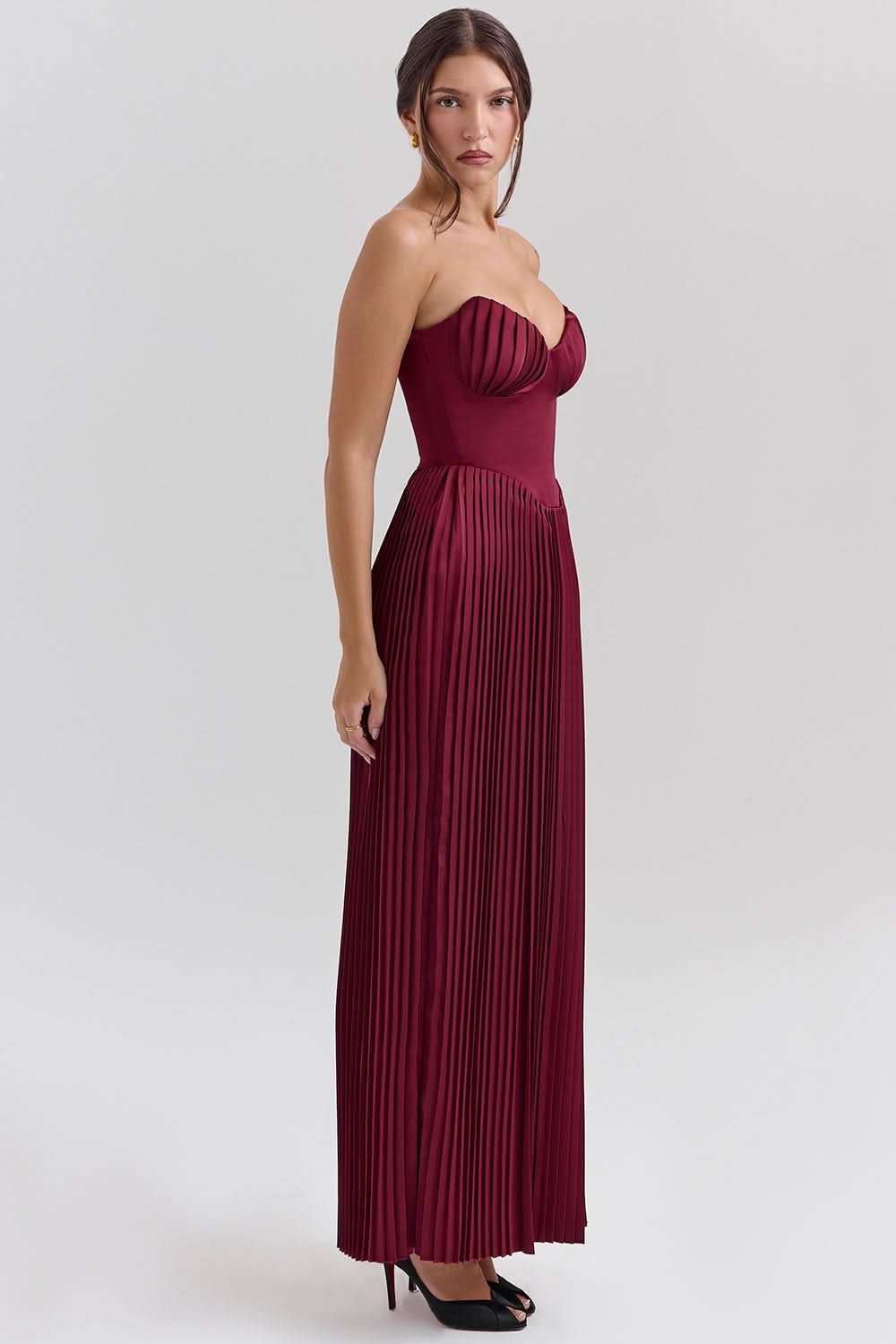 Burgundy strapless maxi dress with pleated skirt and ruched bodice