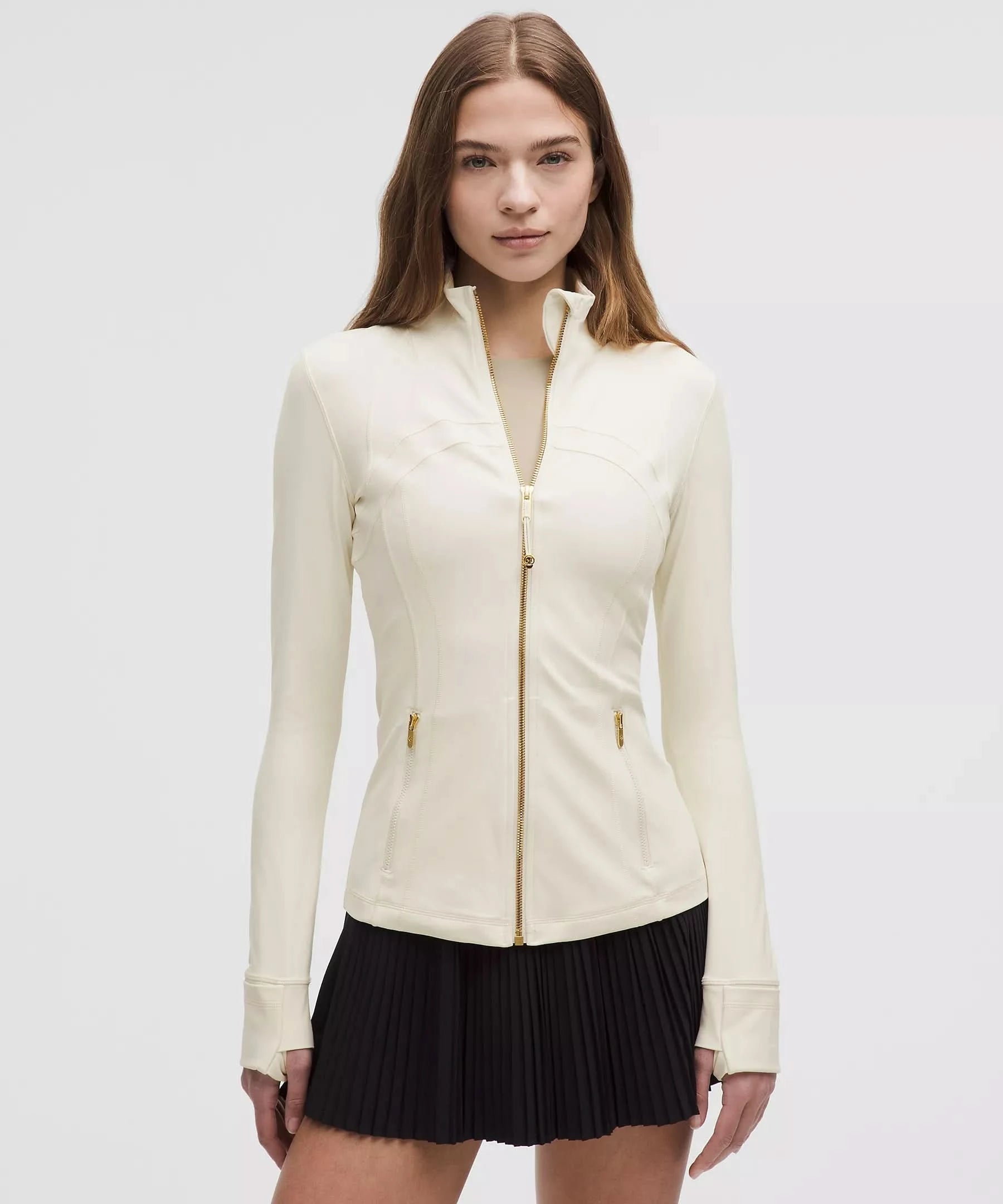 Cream white define jacket with gold hardware and fitted waist
