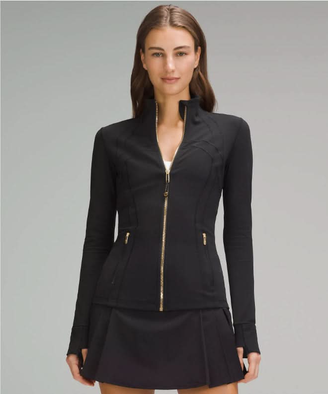Black fitted define jacket with gold zip and side pockets