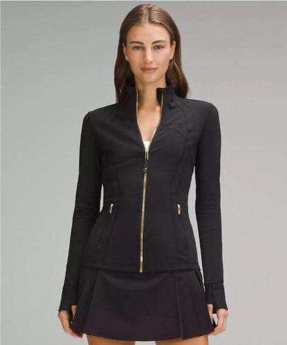 Black fitted define jacket with gold zip and side pockets