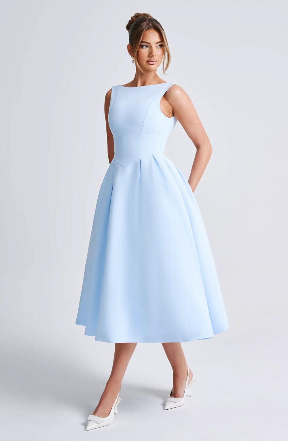 Light blue sleeveless A-line midi dress with round neckline and side pockets