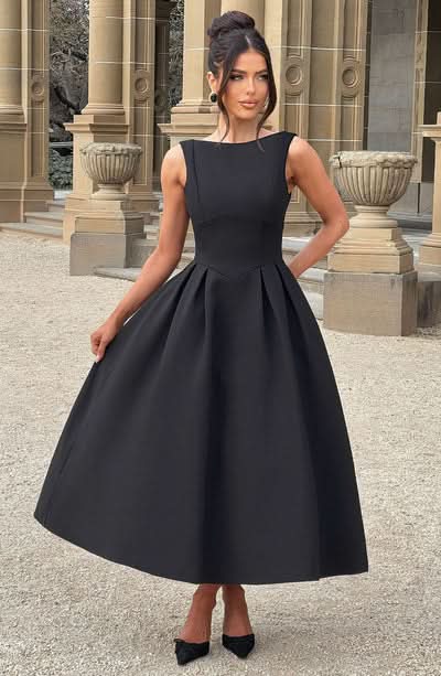 Black sleeveless midi dress with round neckline and full gathered skirt