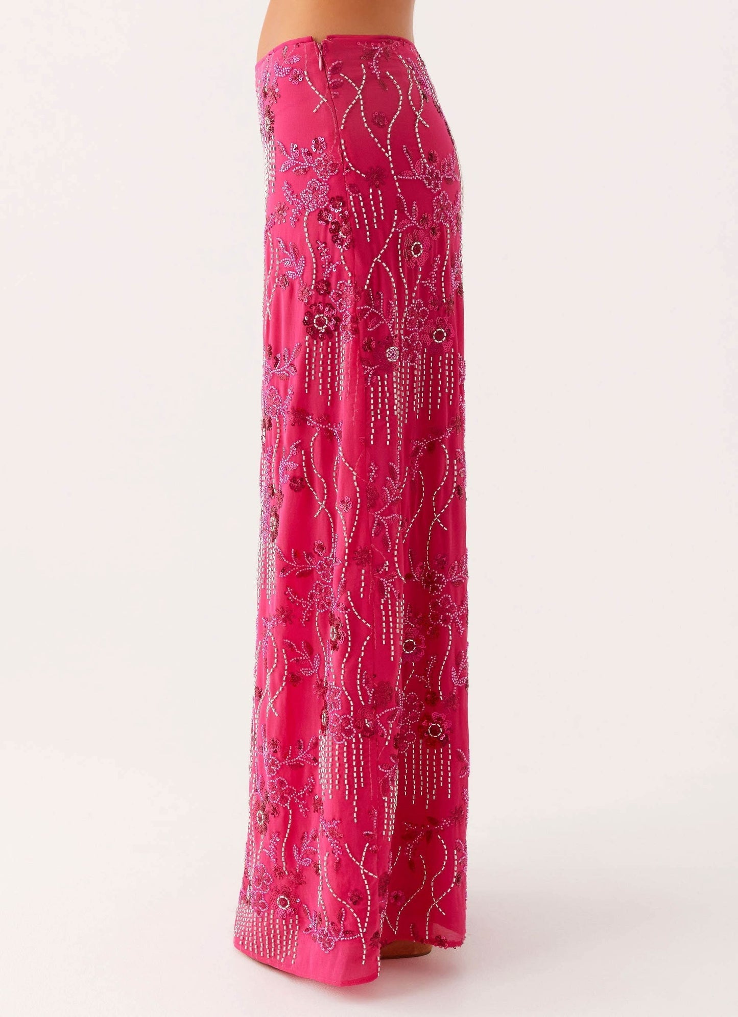 Back view of pink maxi skirt with beaded embroidery and hanging beaded fringe
