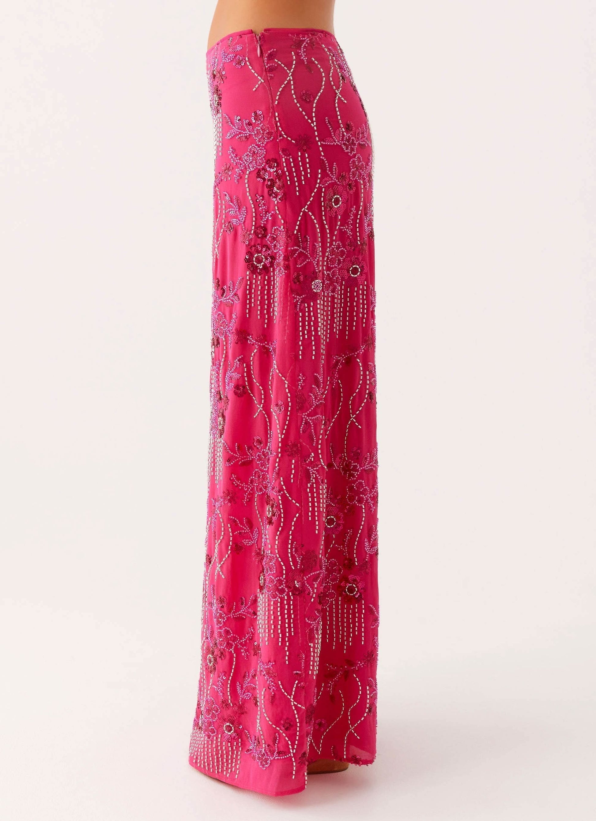 Back view of pink maxi skirt with beaded embroidery and hanging beaded fringe