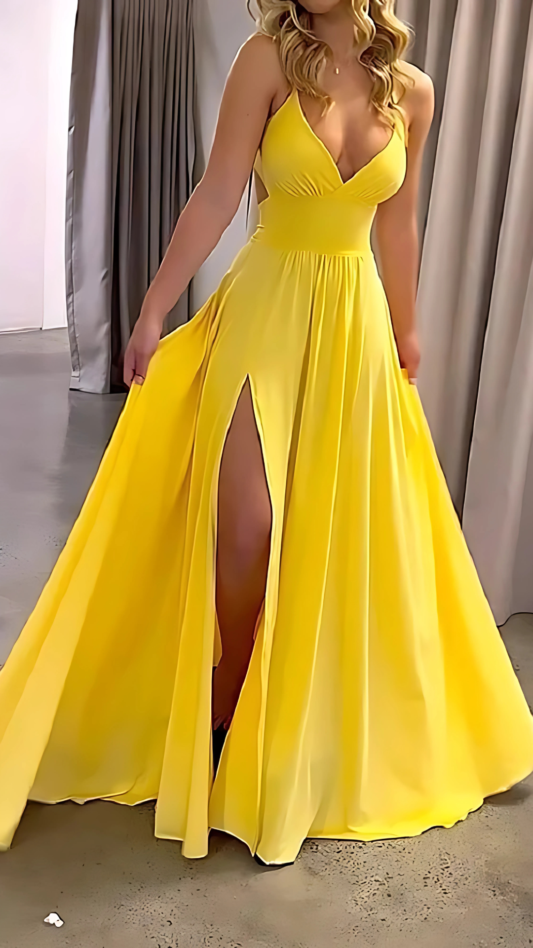 Yellow formal maxi dress with V-neck, cinched waist, and thigh-high slit front