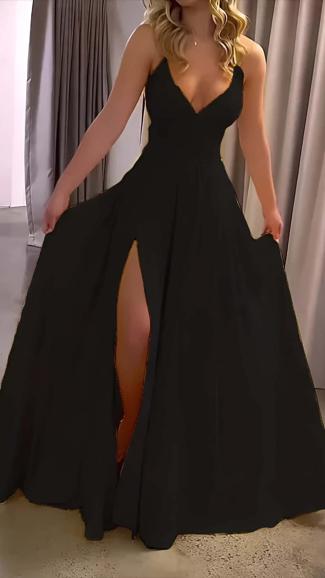 Black formal maxi dress with deep V-neck and dramatic high thigh slit