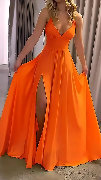 Bright orange halter maxi dress with fitted bodice and flowing floor-length skirt