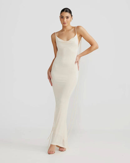 Cream sleeveless backless maxi dress with fitted silhouette, front view for women