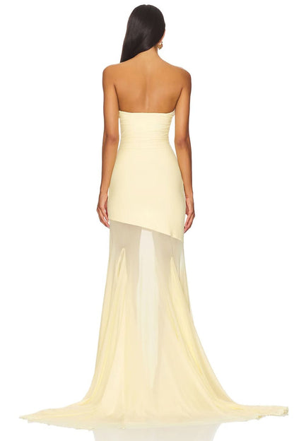 Back view of cream strapless evening gown with asymmetrical sheer overlay