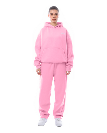 Pink unisex hoodie with kangaroo pocket and matching joggers front view