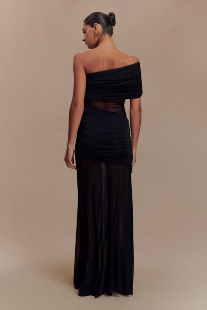 Back view of black off-shoulder maxi dress showing ruched details