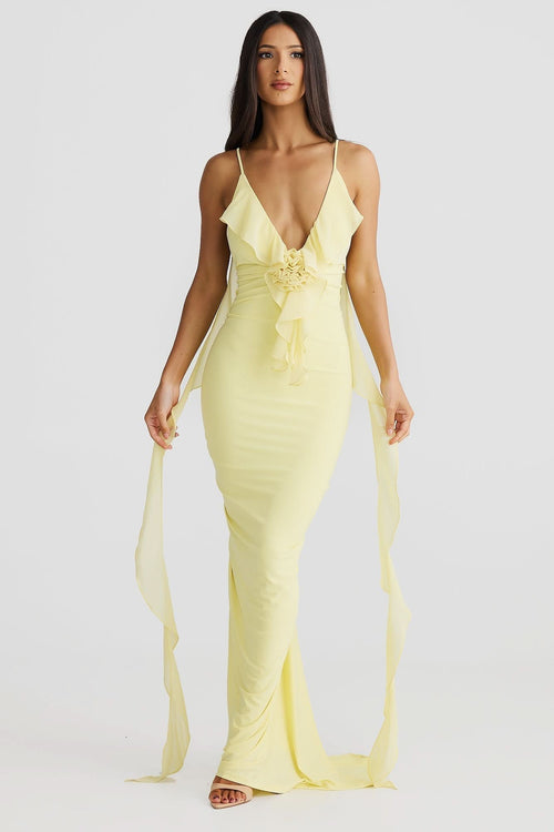 Yellow wrap maxi dress with deep V-neckline, ruched waist detail, and flowing chiffon train