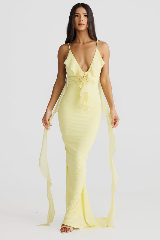 Yellow wrap maxi dress with deep V-neckline, ruched waist detail, and flowing chiffon train