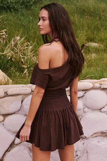 Back view of brown off-shoulder dress with smocked waist detail