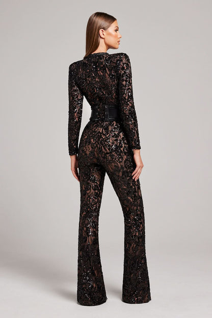 Back view of black lace jumpsuit with studded belt