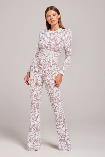 White lace jumpsuit with long sleeves and cream waist belt