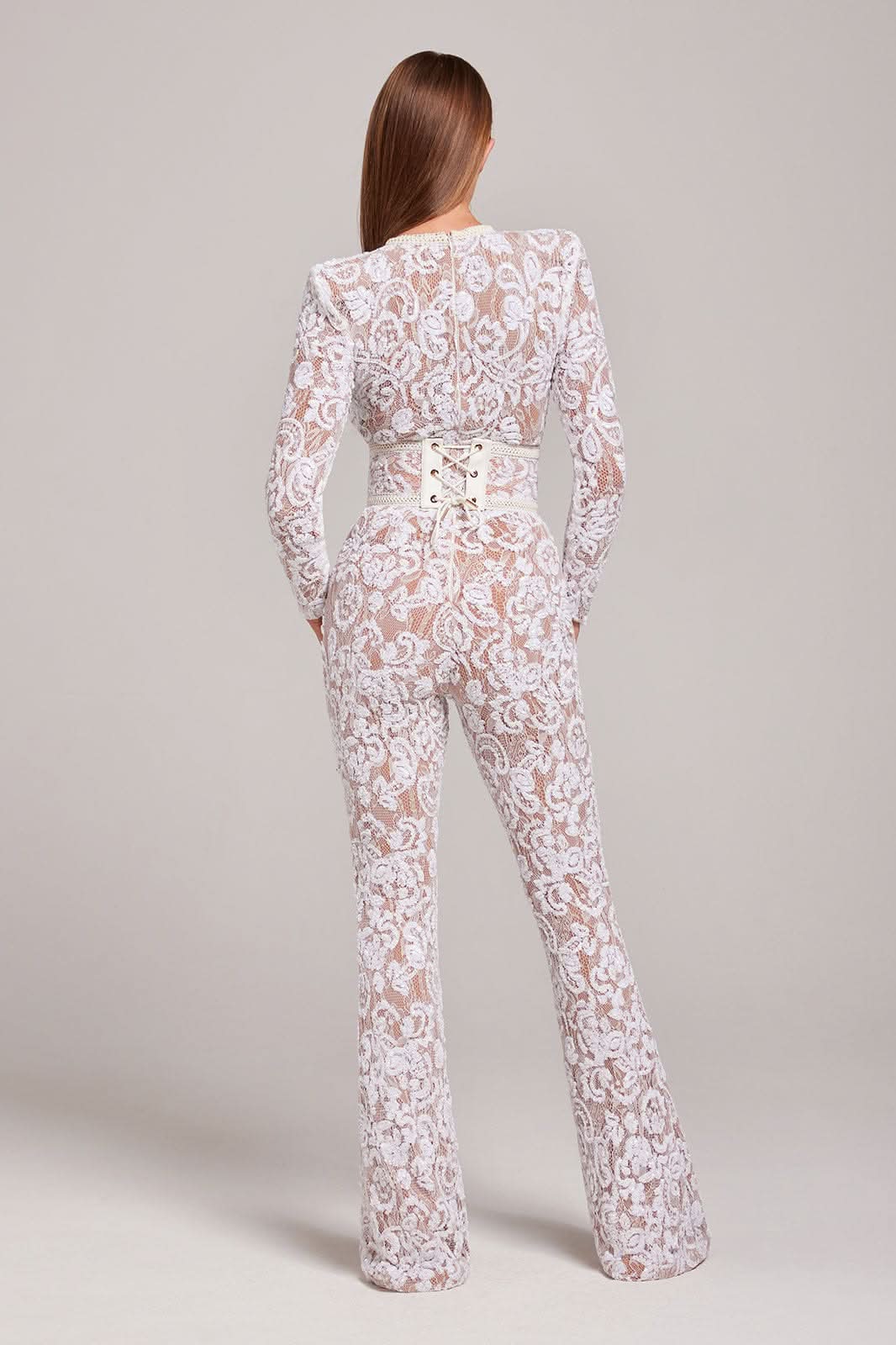 Back view of white lace jumpsuit with lace-up waist detail
