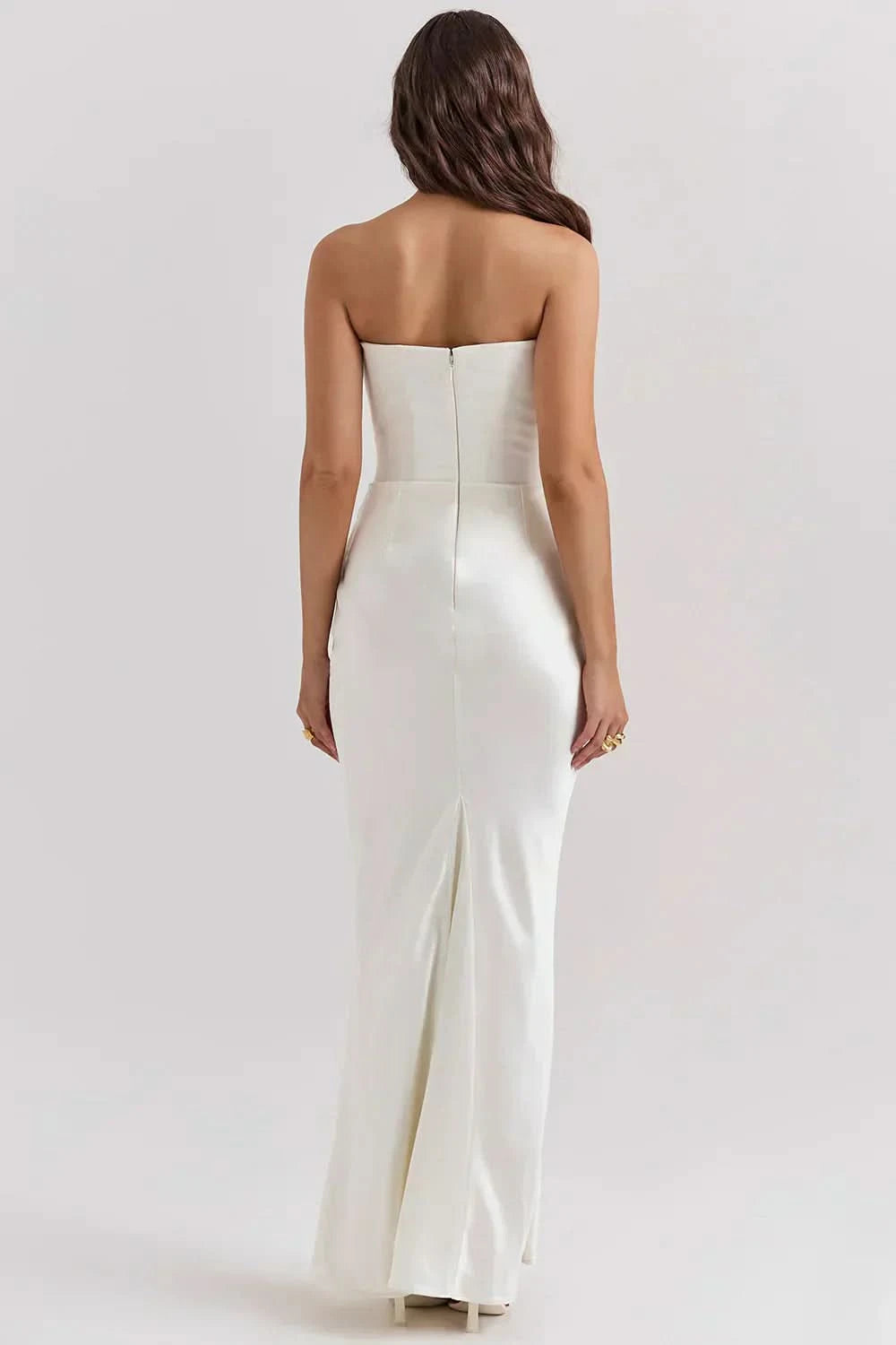 Cream strapless corset maxi dress with fitted bodice and floor-length skirt, back view