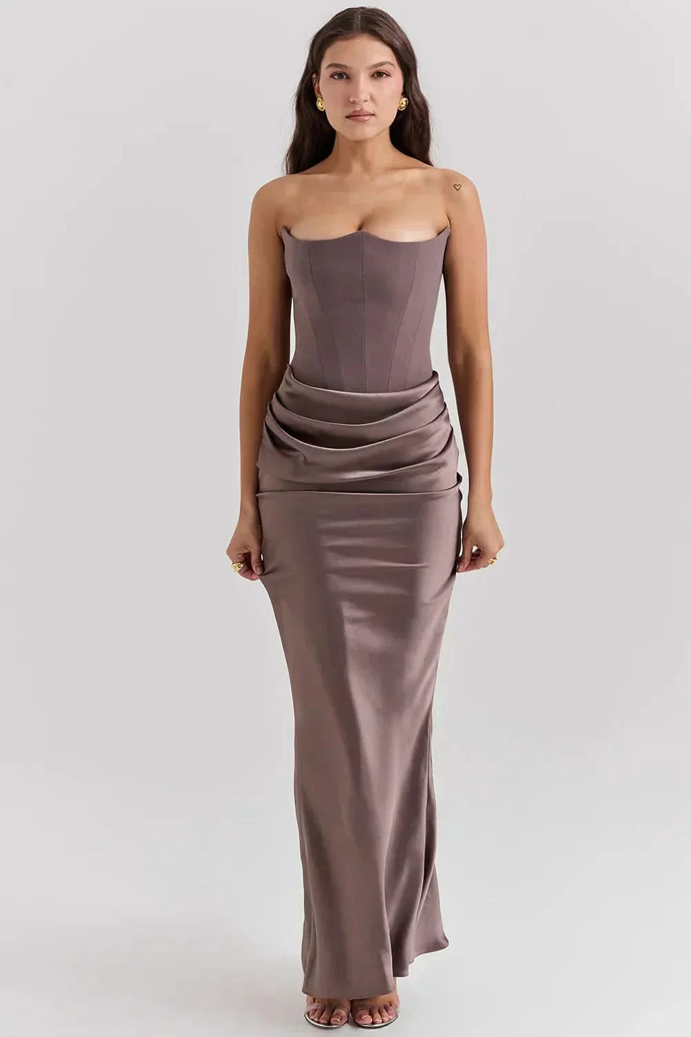 Taupe strapless corset maxi dress with ruched waist detail and draped skirt, front view