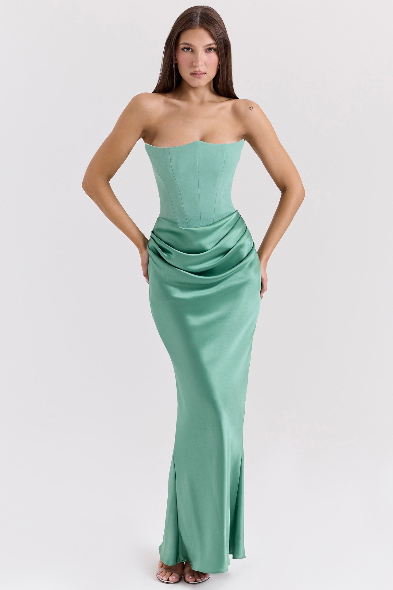 Sage green strapless corset maxi dress with draped waist and fitted silhouette