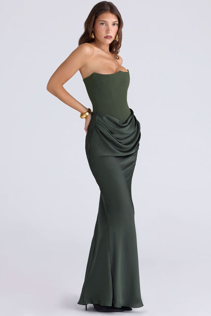 Side view of forest green corset maxi dress with draped hip ruching