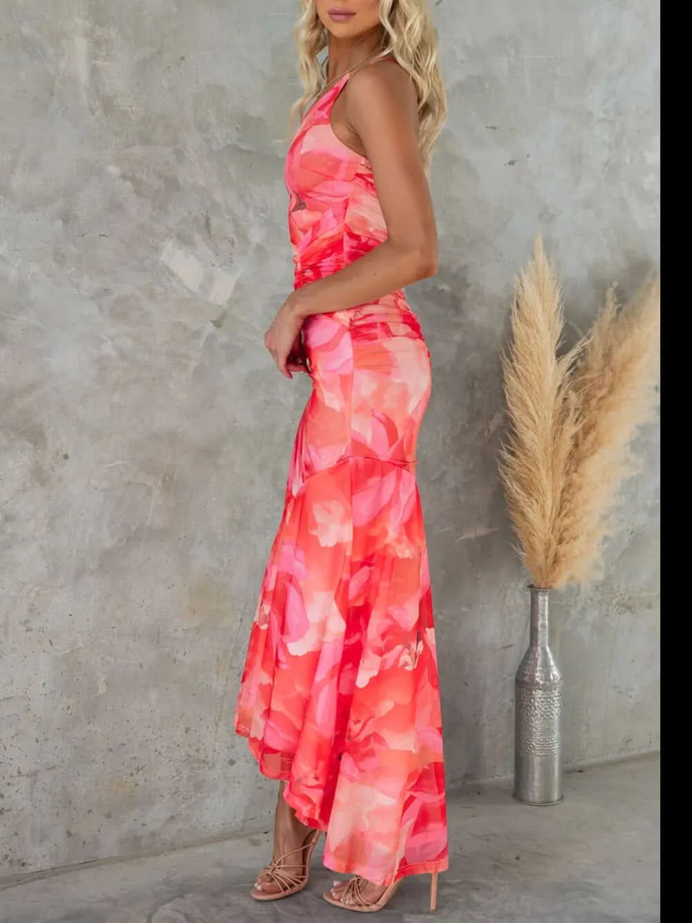 Back view of coral pink floral maxi dress with high-low hem