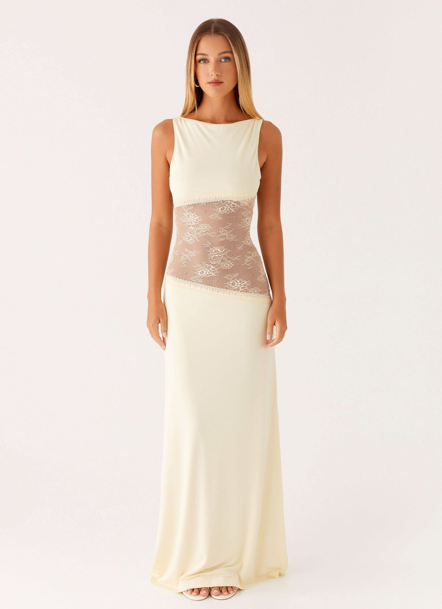 Cream sleeveless maxi dress with sheer lace waist band and fitted silhouette