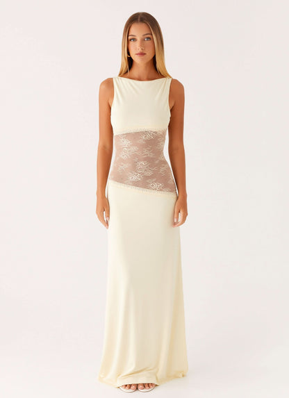 Cream sleeveless maxi dress with sheer lace waist band and fitted silhouette