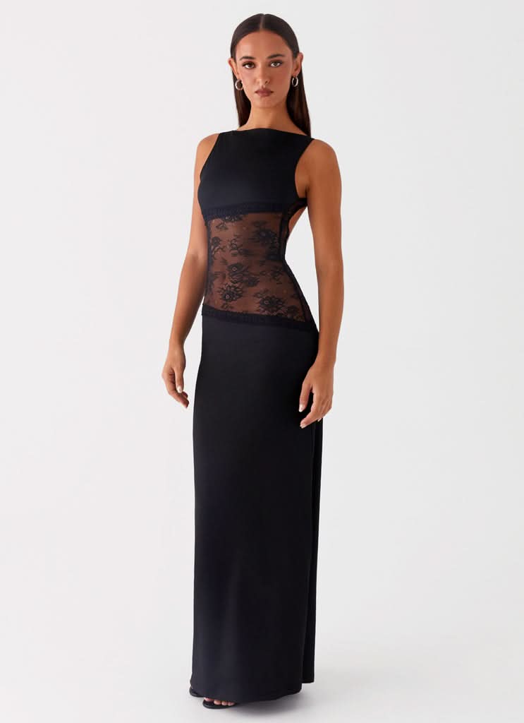 Black sleeveless maxi dress with lace detail at waist, side view