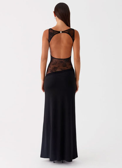 Black maxi dress with open back and sheer lace waist insert, rear view