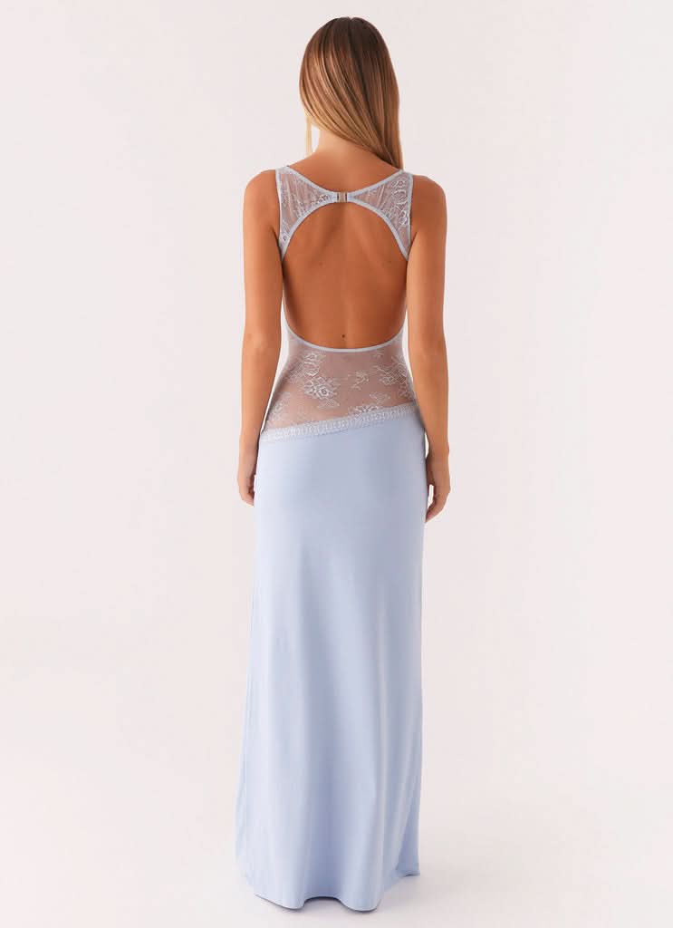 Light blue sleeveless maxi dress with lace waist panel and open back detail