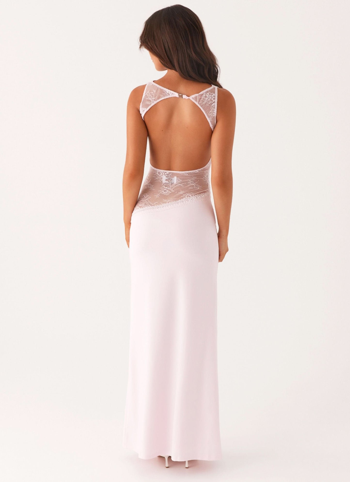 Pale pink sleeveless maxi dress with lace waist and open back, rear view