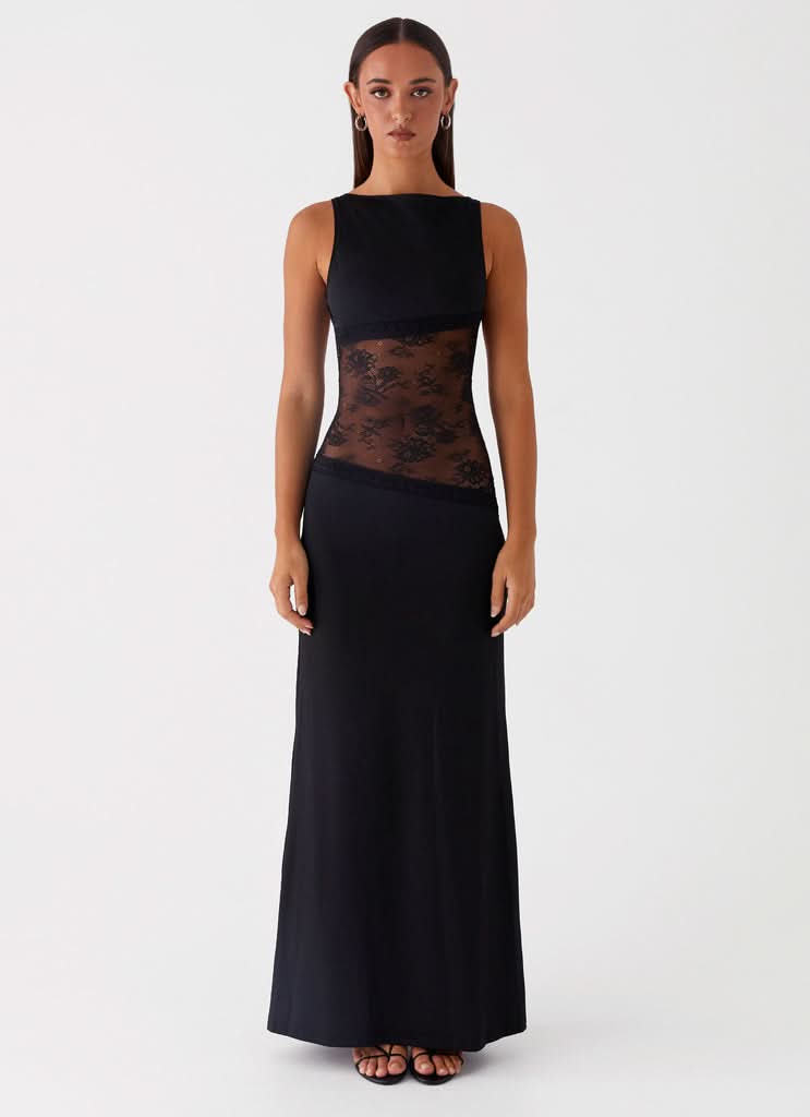 Black sleeveless maxi dress with sheer lace waist panel and floor-length skirt