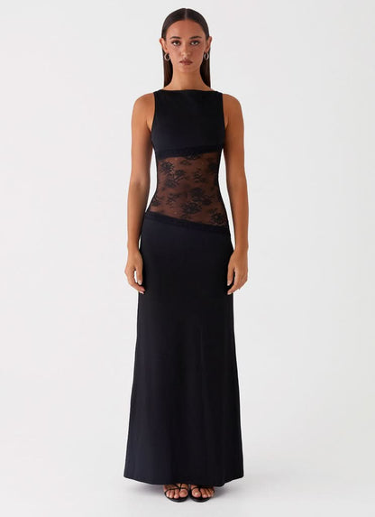 Black sleeveless maxi dress with sheer lace waist panel and floor-length skirt