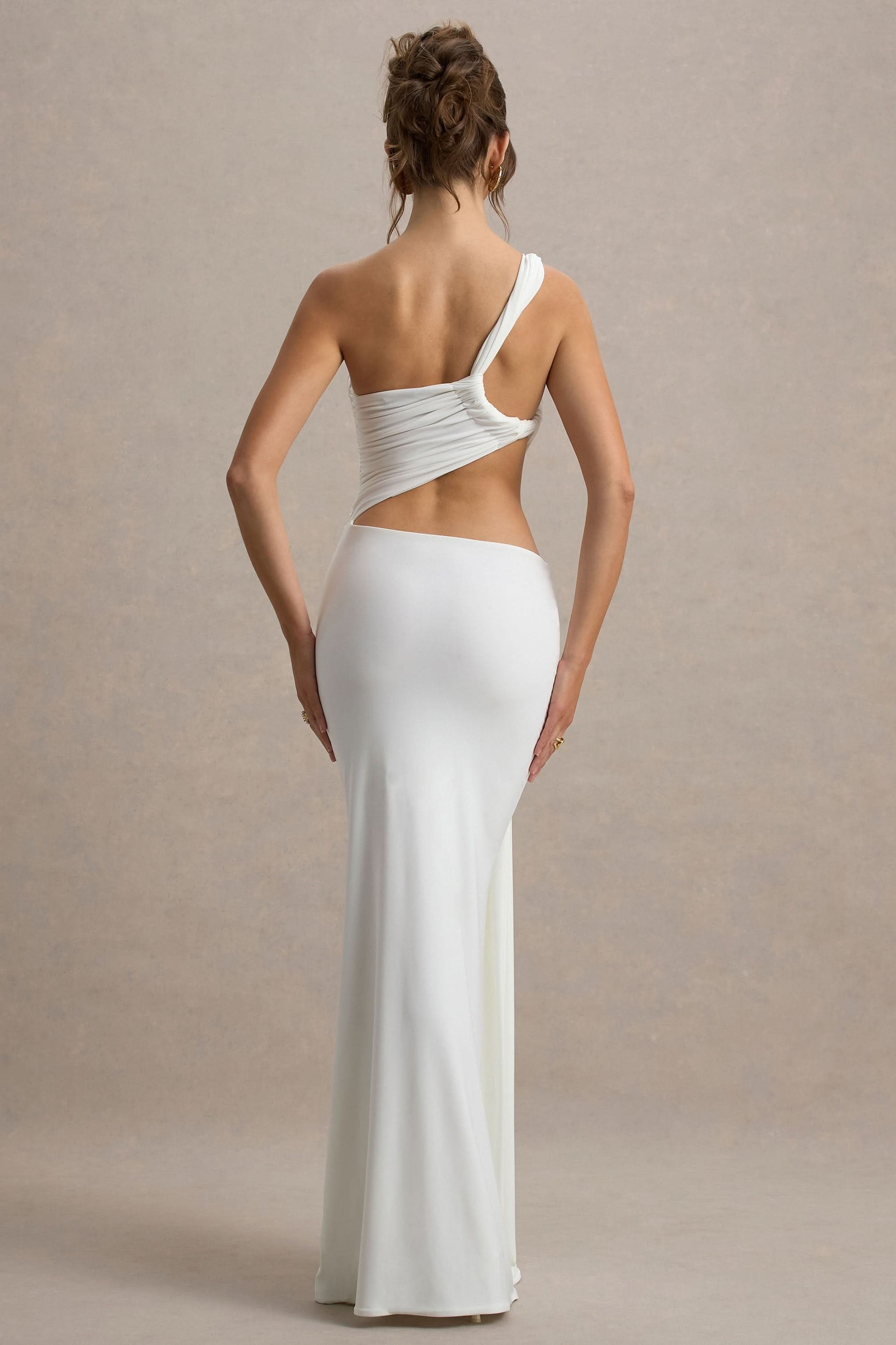 Back view of white asymmetric maxi dress with open back cutout detail