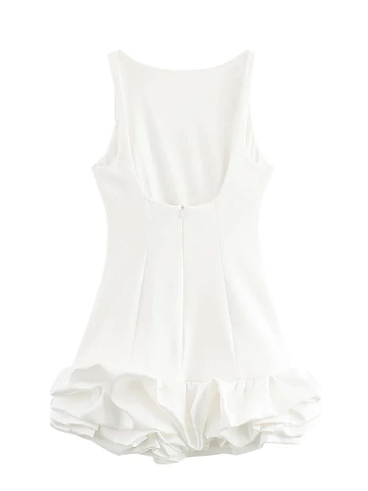 Side profile of white fitted mini dress with ruffled bubble skirt hem