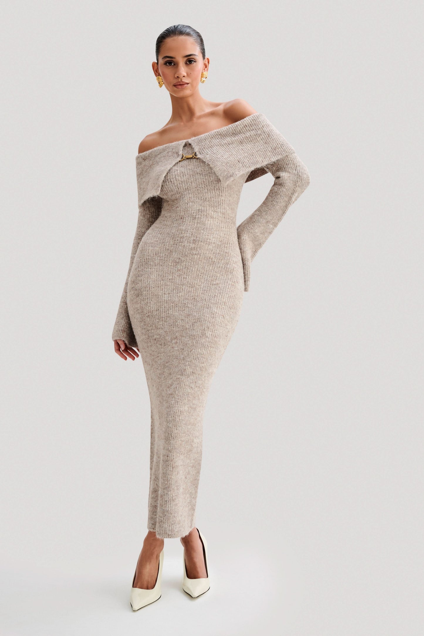 Beige ribbed off-shoulder knit midi dress with long sleeves and gold clasp detail
