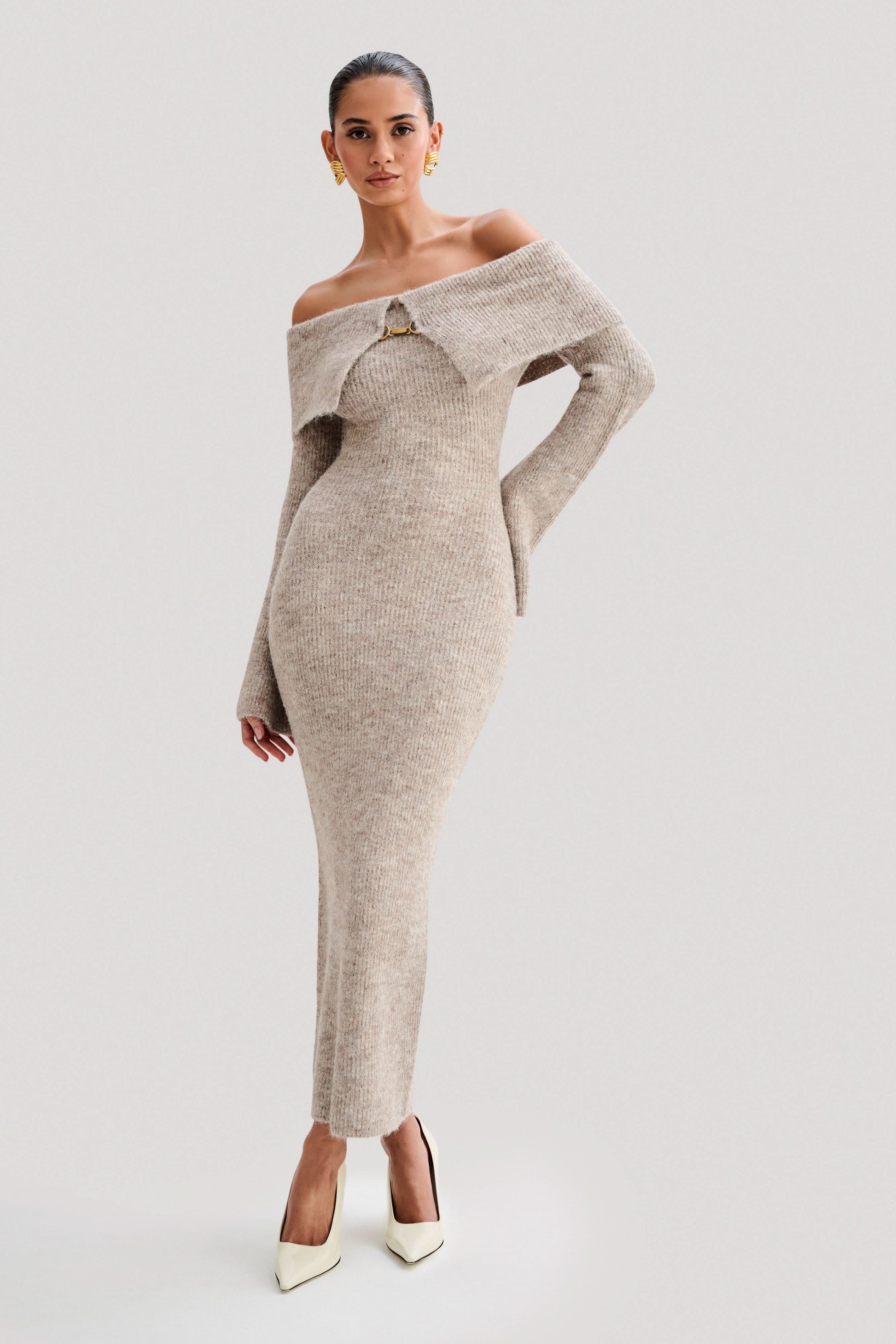 Beige ribbed off-shoulder knit midi dress with long sleeves and gold clasp detail