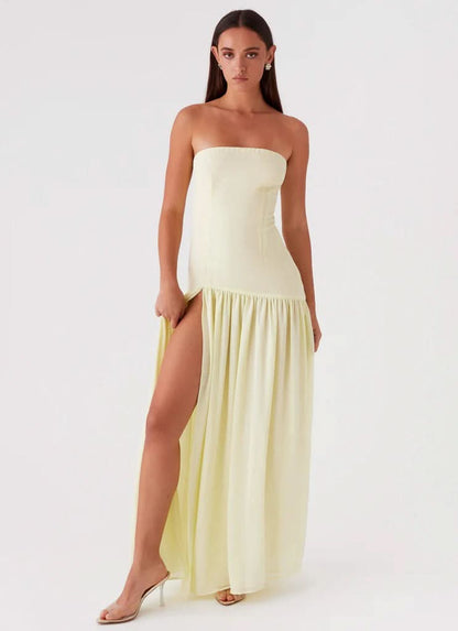 Chocolate brown strapless maxi dress with gathered hem, side angle view