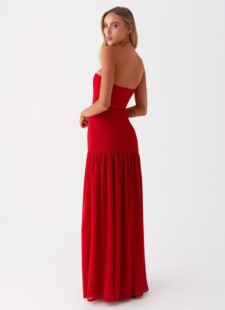 Red strapless maxi dress with ruched skirt, side view