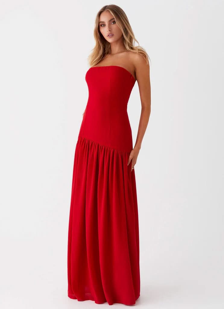 Red strapless evening maxi dress with pleated floor-length skirt