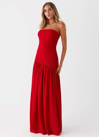Red strapless evening maxi dress with pleated floor-length skirt