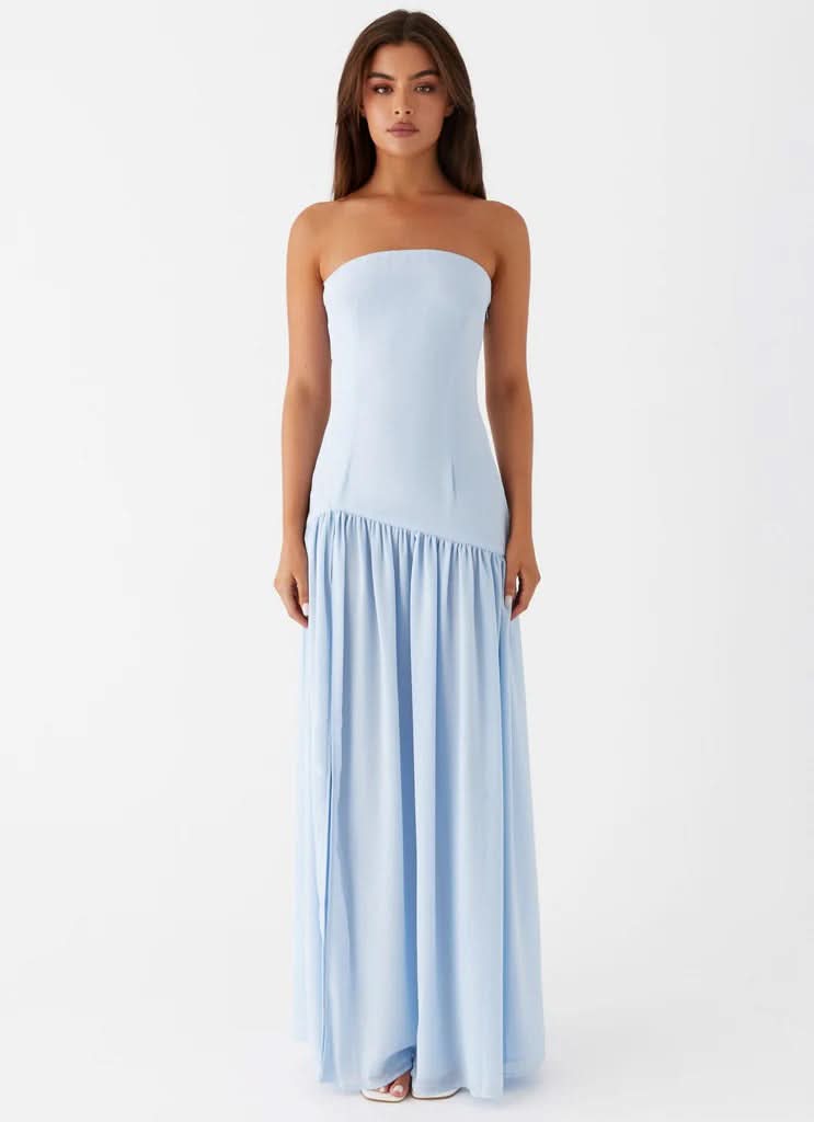 Front view of light blue strapless maxi dress with fitted bodice and flowing skirt