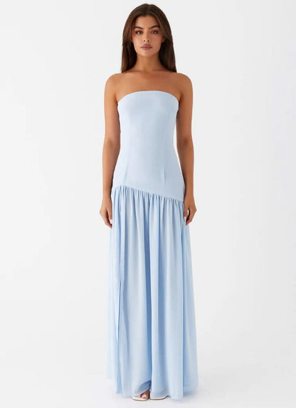 Front view of light blue strapless maxi dress with fitted bodice and flowing skirt