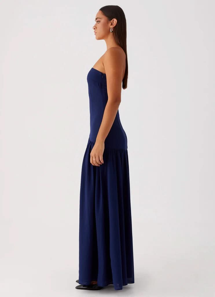 Navy blue strapless maxi dress with gathered train detail