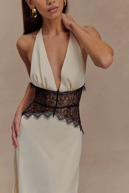 Cream halter maxi dress with deep V-neckline and black lace detail