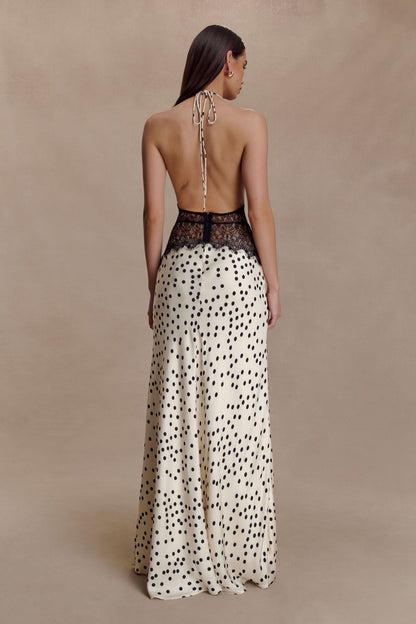 Back view of cream polka dot maxi dress with halter tie closure
