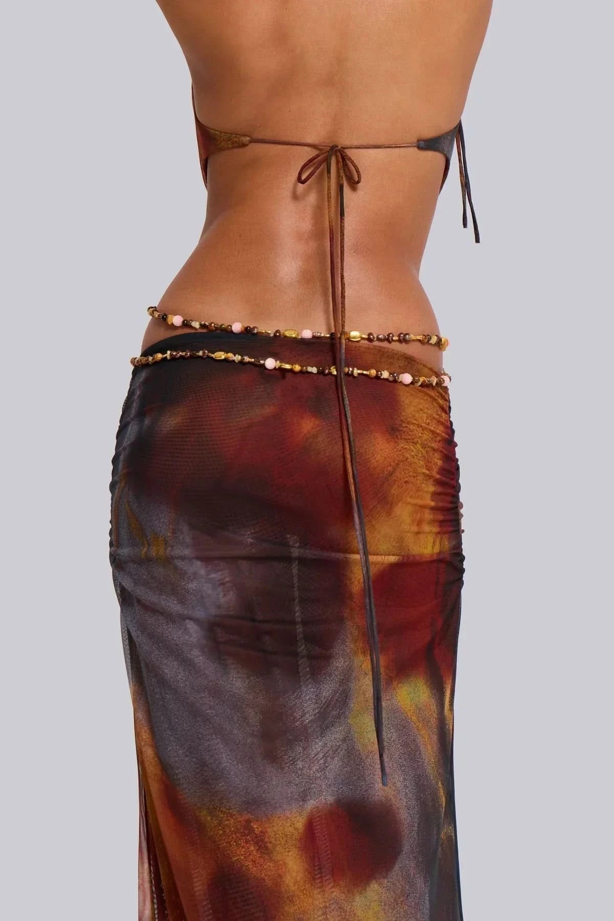 Side back view of burgundy animal print maxi dress with adjustable halter tie closure