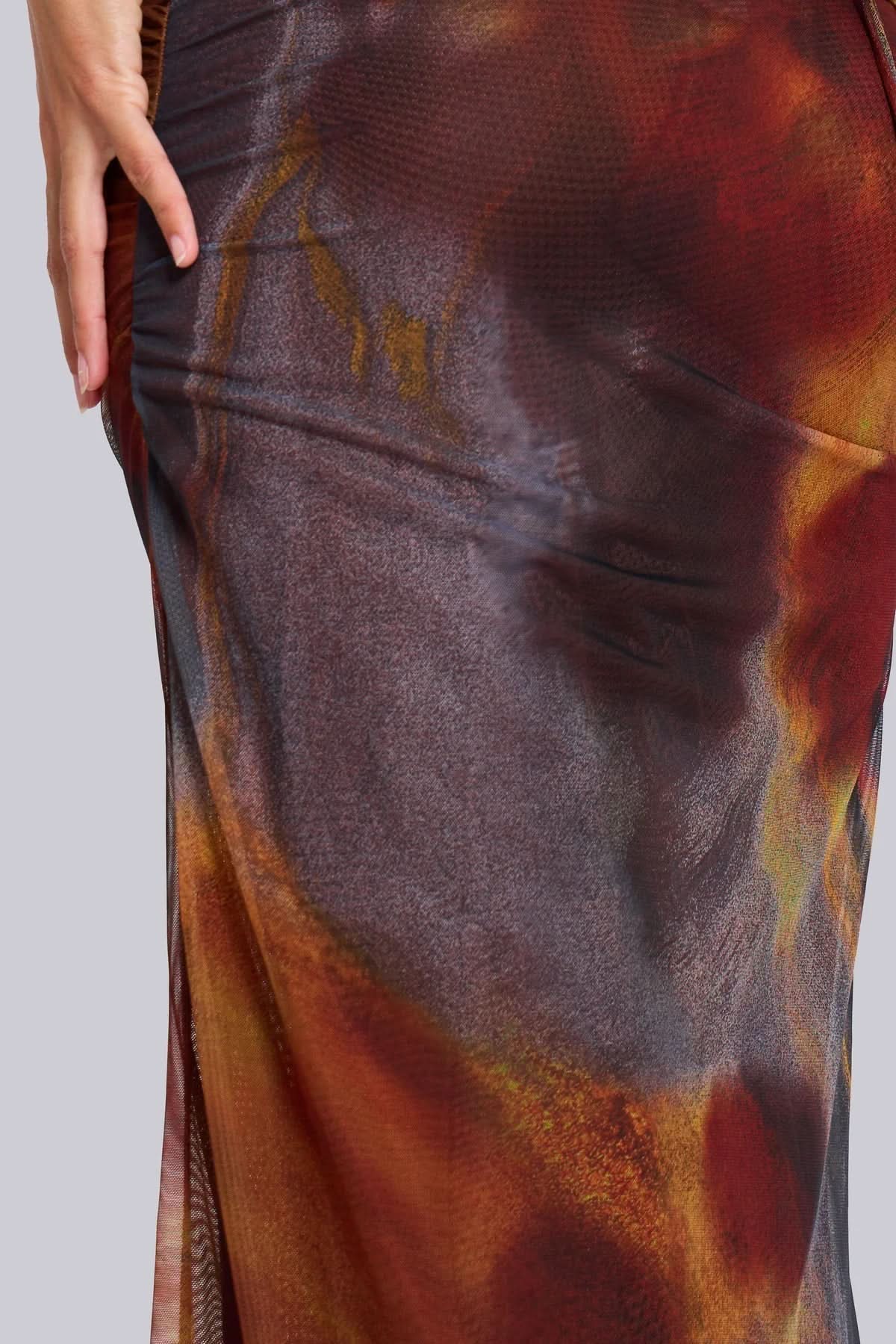 Floor-length animal print mesh maxi dress showing fabric texture and color gradient